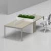 Office furniture workstation desk has custom made space for planters also made with metal leg